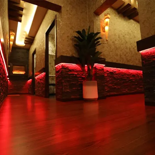 Private massage room at Rangeela Spa Ajman with clean bed and warm ambient lighting