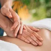 Kerala warm oil massage in Ajman with long rhythmic strokes